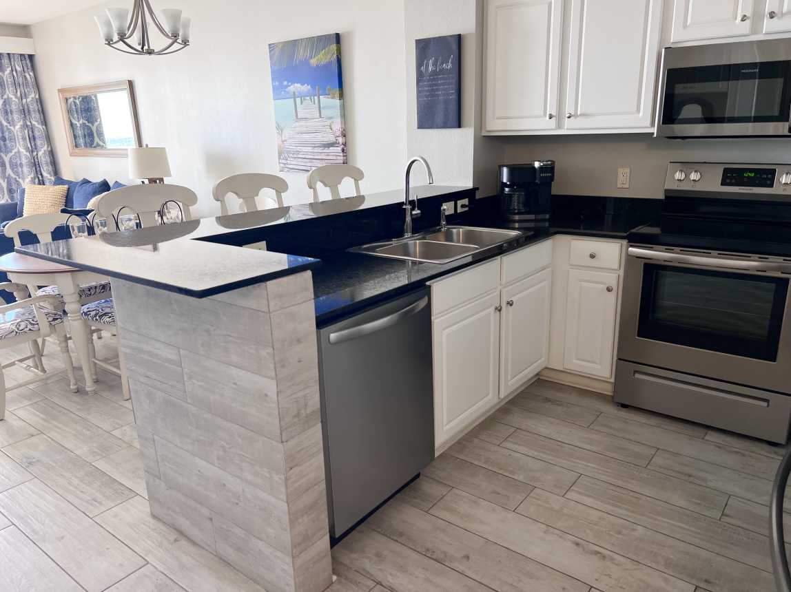 Stainless steel appliances and fully stocked kitchen for easy meals!