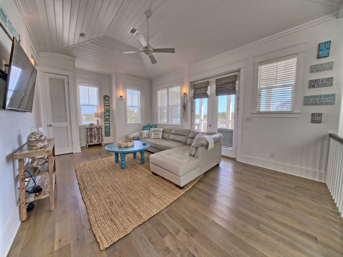 3RD FLOOR LIVING SPACE W/ BALCONY THAT OPENS TO SUMMER KITCHEN