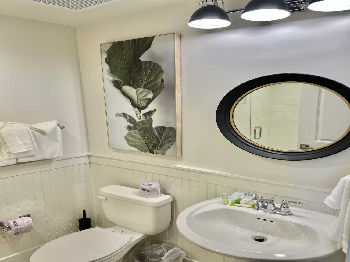 Guest Bath with Glass Enclosed Shower Stall - Cute Powder Room off Hallway.