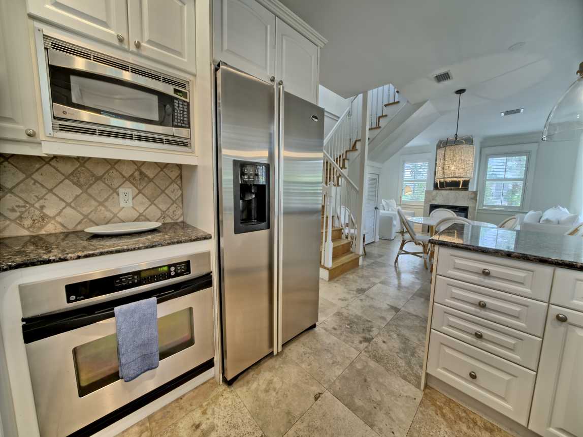 Chef's kitchen with stainless appliances &amp; granite countertops.