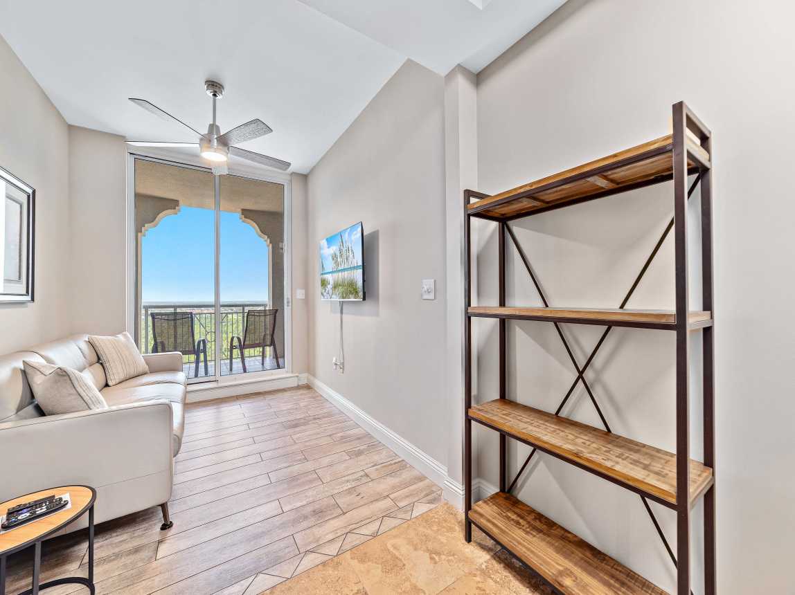 Media Room with Natuzzi leather sleeper sofa, wall tv,  and "second" balcony