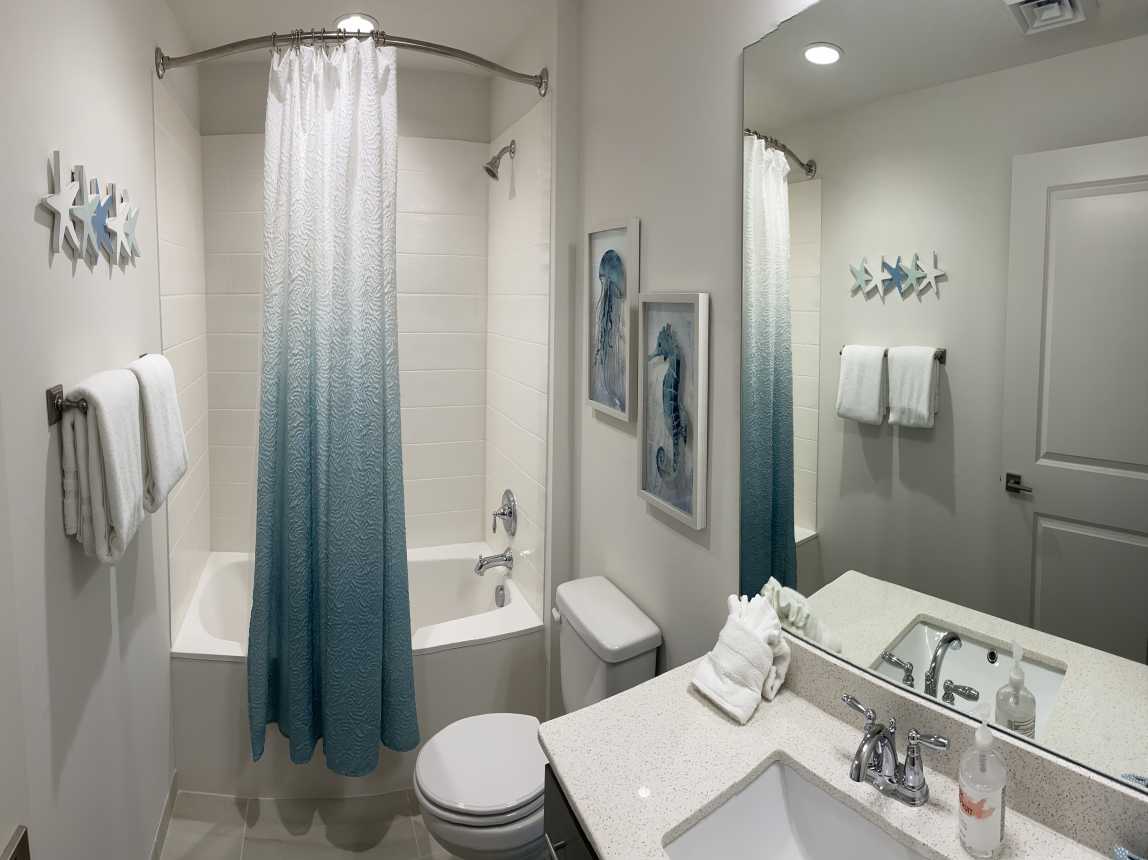 Guest Bath is conveniently located right across the hallway from the bunkbeds:)