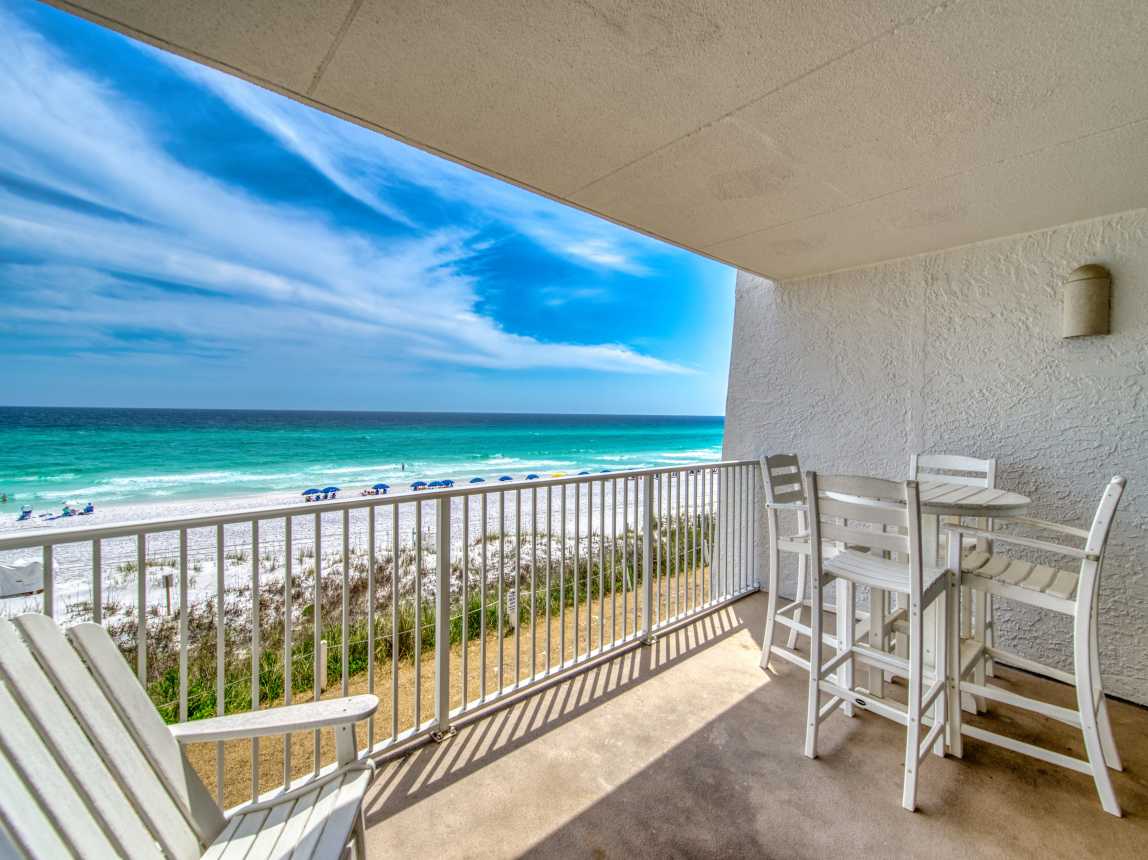 Relax on your private balcony with breathtaking beach views!