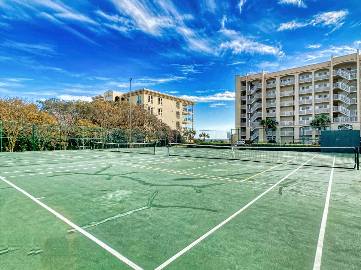 Enjoy a friendly match on our lighted tennis courts with a beachside breeze!