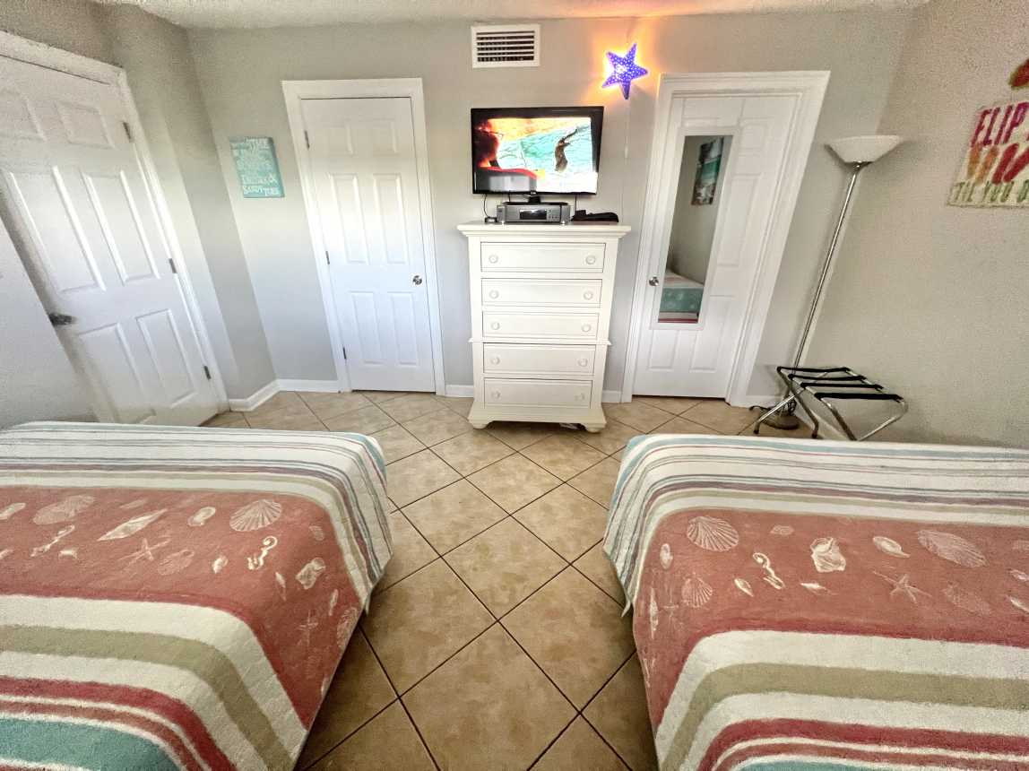 Spacious Guest Bedroom with Two Queen Size Beds, Bath Access, &amp; Walk in Closet.