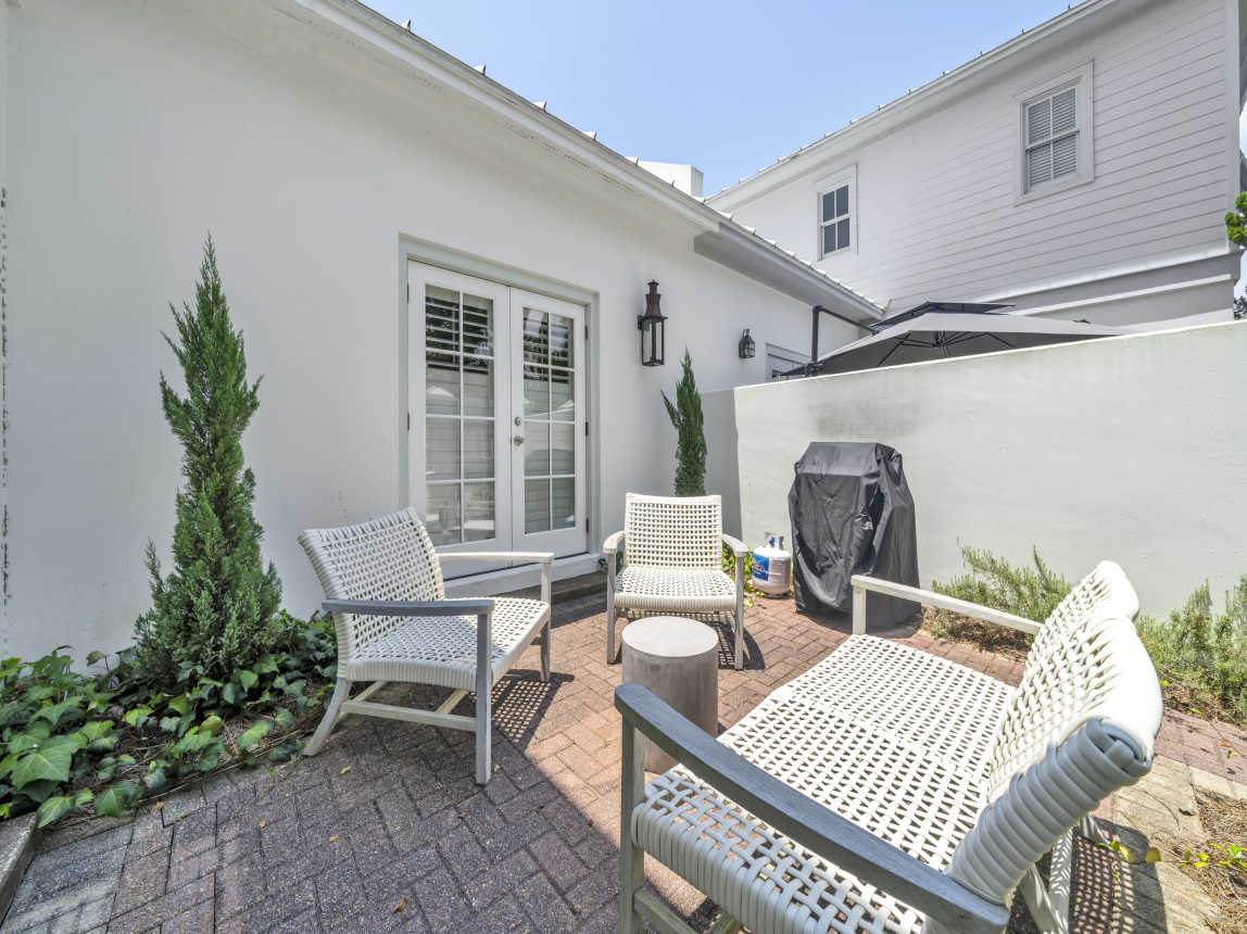 Private courtyard from master bedroom.  Comfortable seating and gas grill.