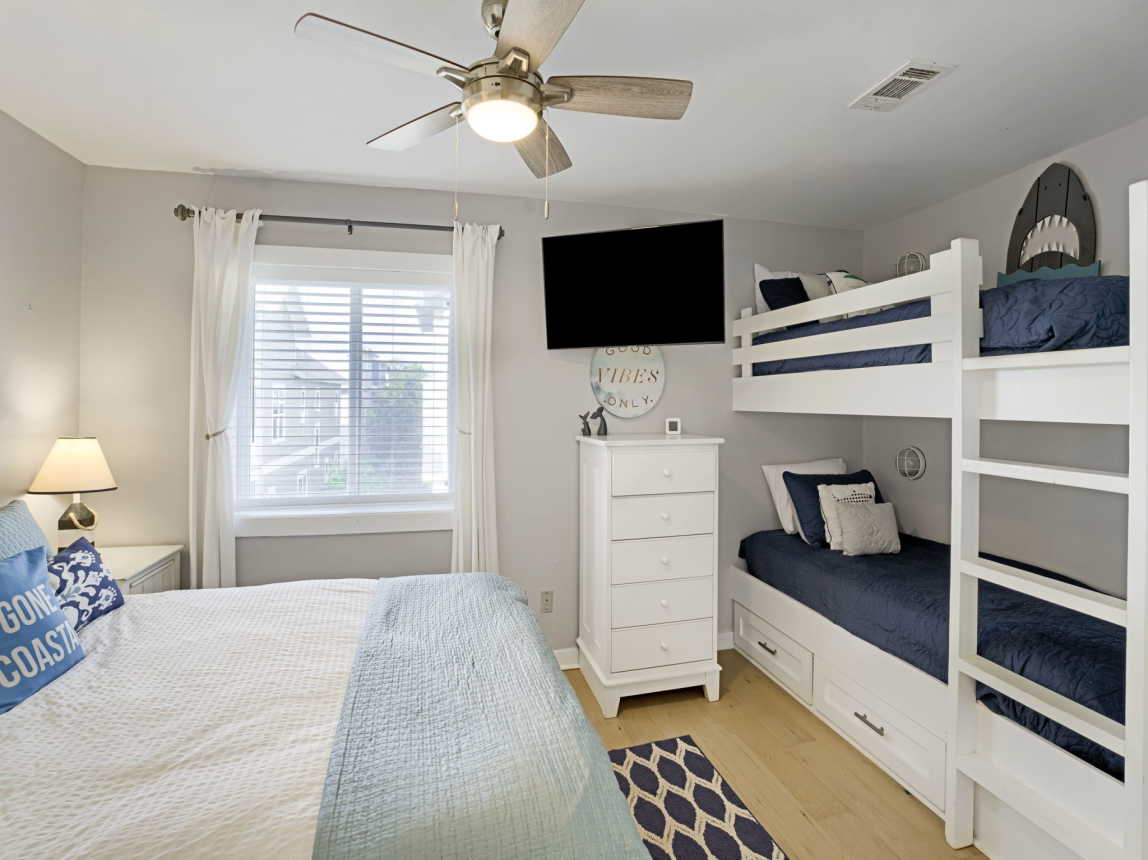 Guest bedroom with Queen size bed and oversized Twin XL bunk beds - smart TV