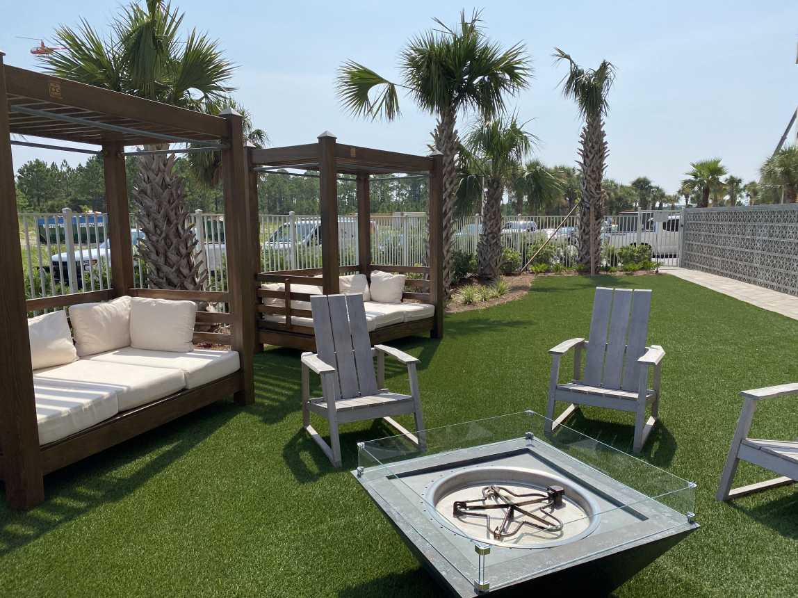 Relax in the cushioned lounges as the kiddos roast s'mores in the fire pit!