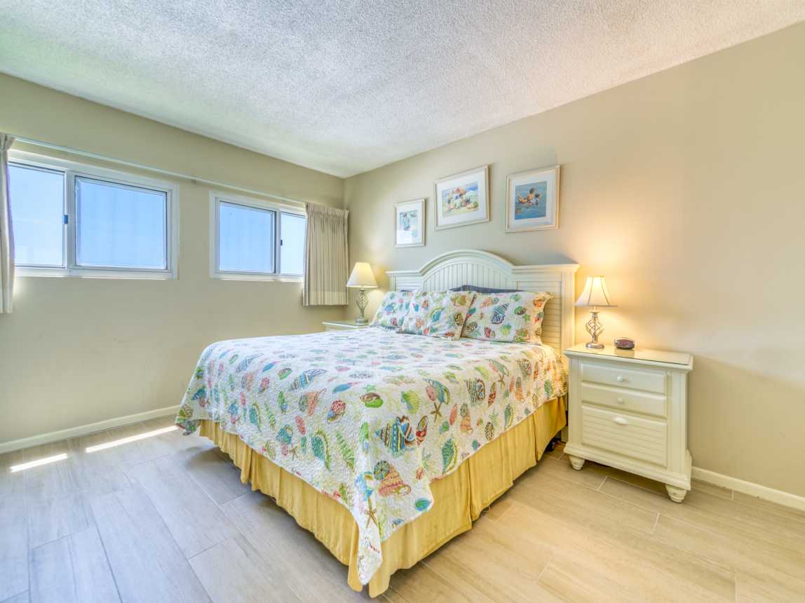 Sleep soundly in a comfy king bed with a serene beach vibe.