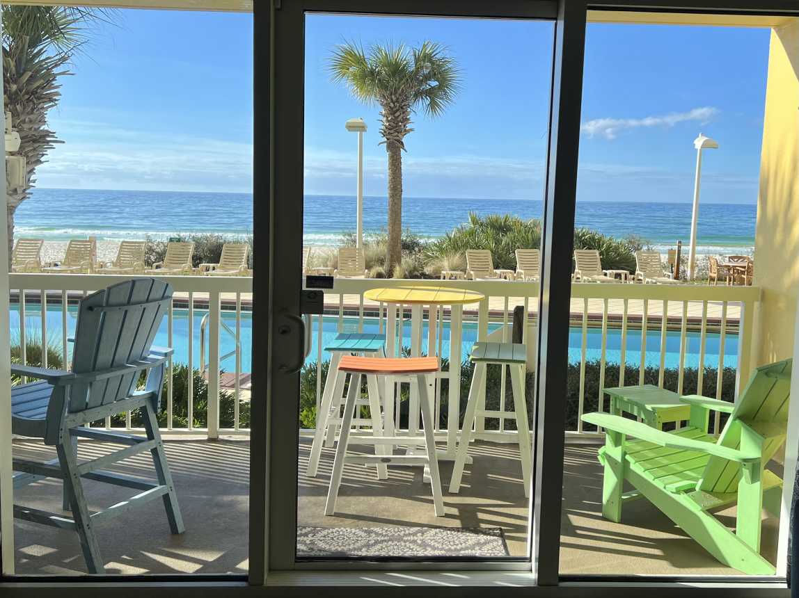 LIFE IS GOOD on this balcony with 2 table sets and Adirondack chair. TOYS TOO!