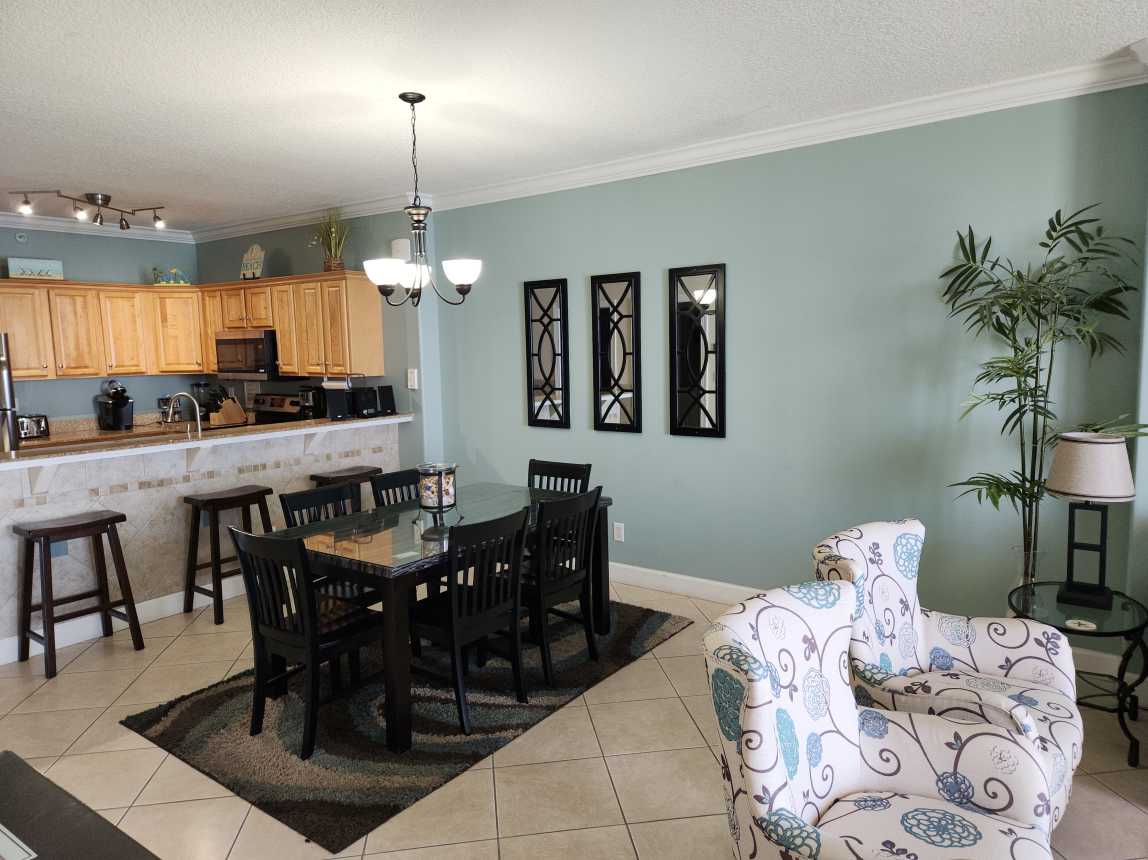 Dining area with additional breakfast bar seating.