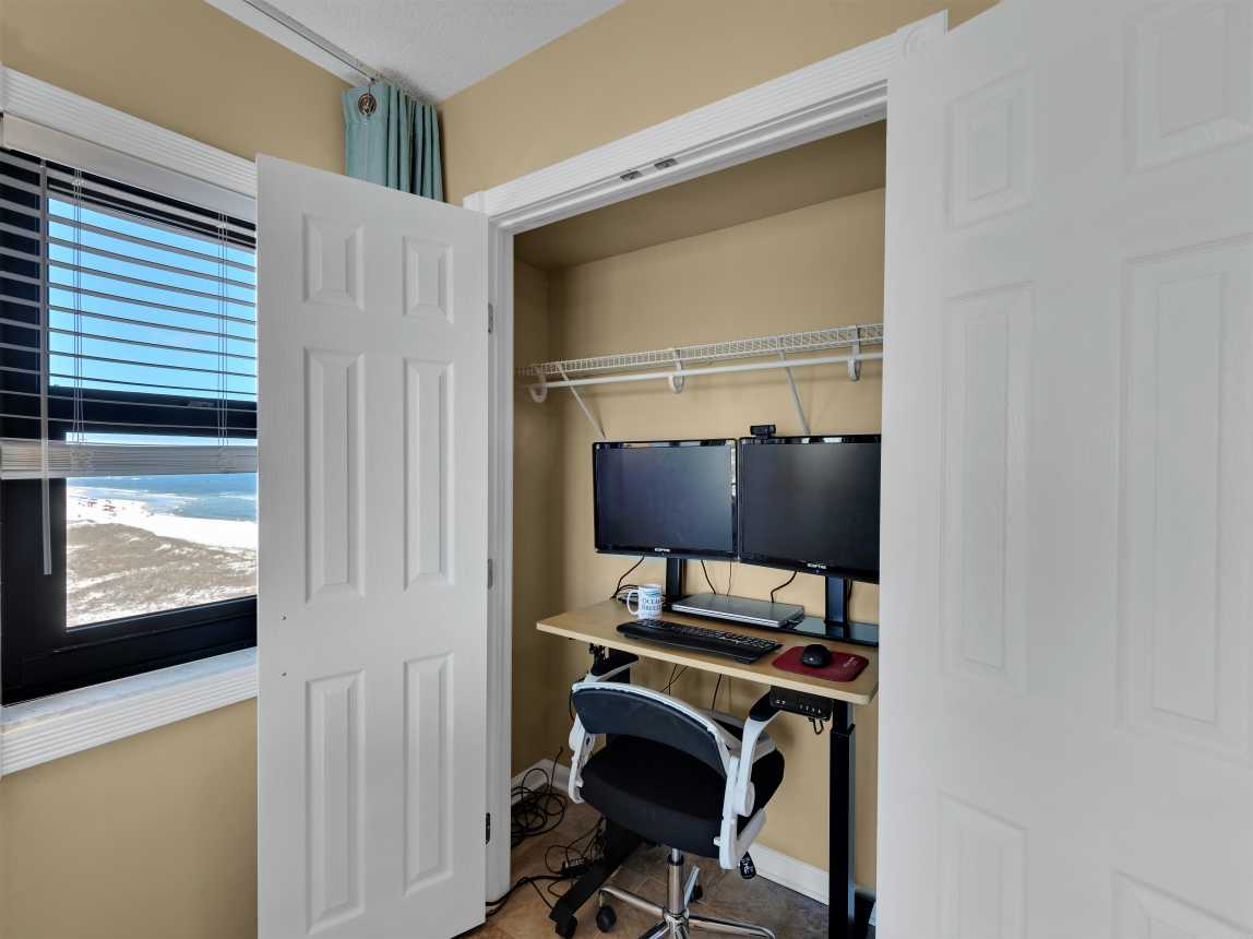 Adjustable height hidden work station w/ dual monitors &amp; docking station w/ view