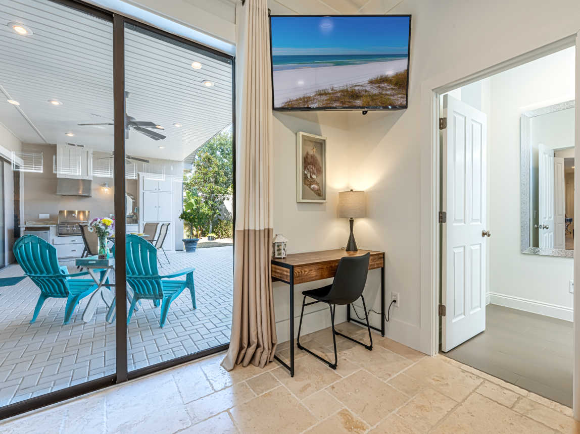 Primary Bedroom with Large Windows and Smart TV