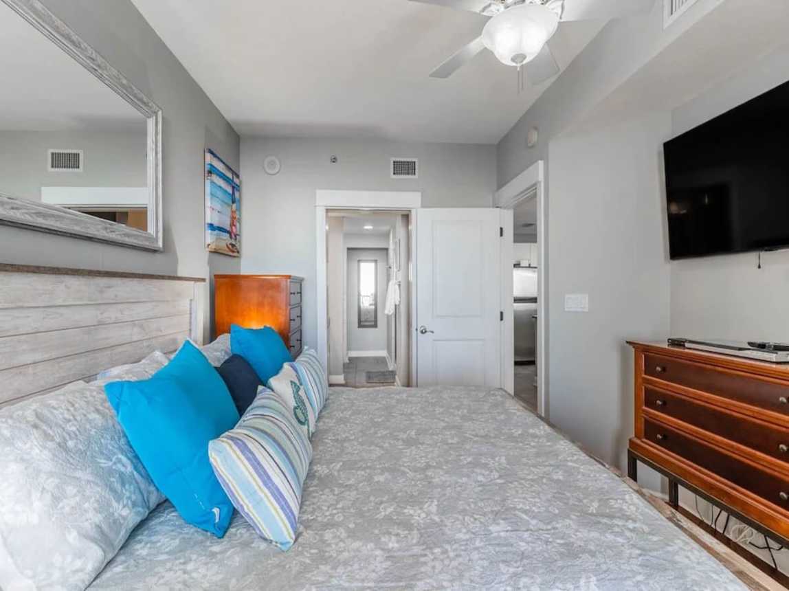 Master Bedroom with 55-inch Smart TV and access to Balcony