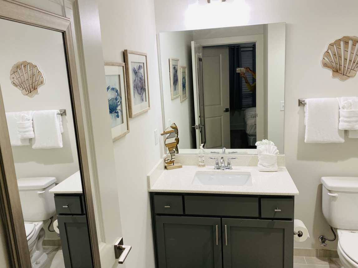 Ensuite master bath has glass enclosed shower with built-in seat.  