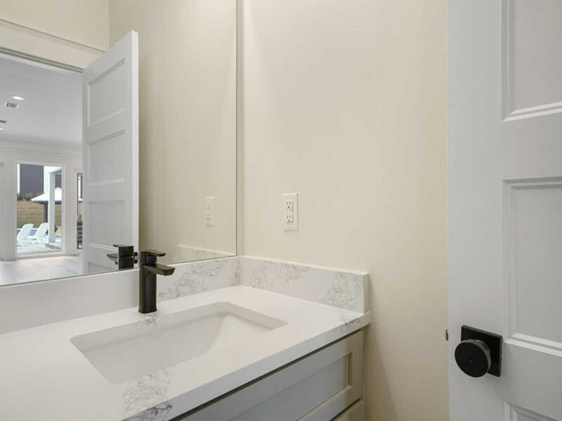 Deja Blue - Extravagant Vacation Beach House with Private Pool with Swim Up Bar, Putting Green, Sand Volleyball, and Rooftop Grill in Blue Mountain Beach, Florida - Five Star Properties Destin/30A