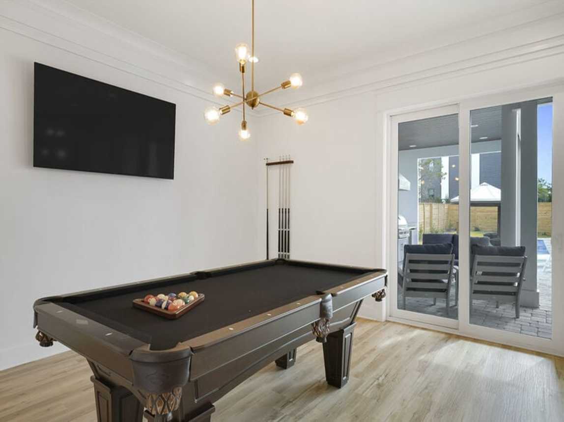 Deja Blue - Extravagant Vacation Beach House with Private Pool with Swim Up Bar, Putting Green, Sand Volleyball, and Rooftop Grill in Blue Mountain Beach, Florida - Five Star Properties Destin/30A