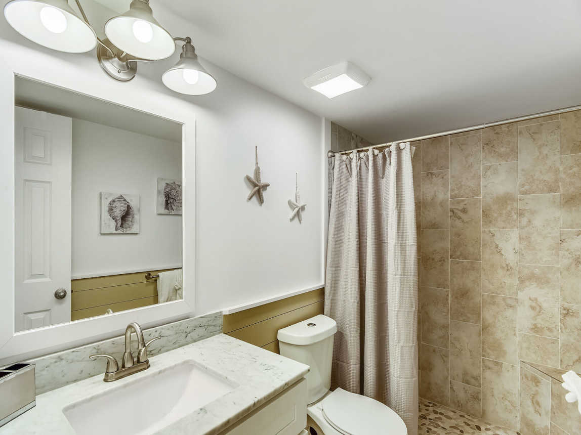 Hall bathroom is located just outside the guest bedroom
