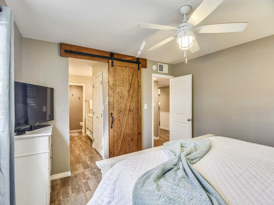 Updated with barn style door to bathroom/dressing area