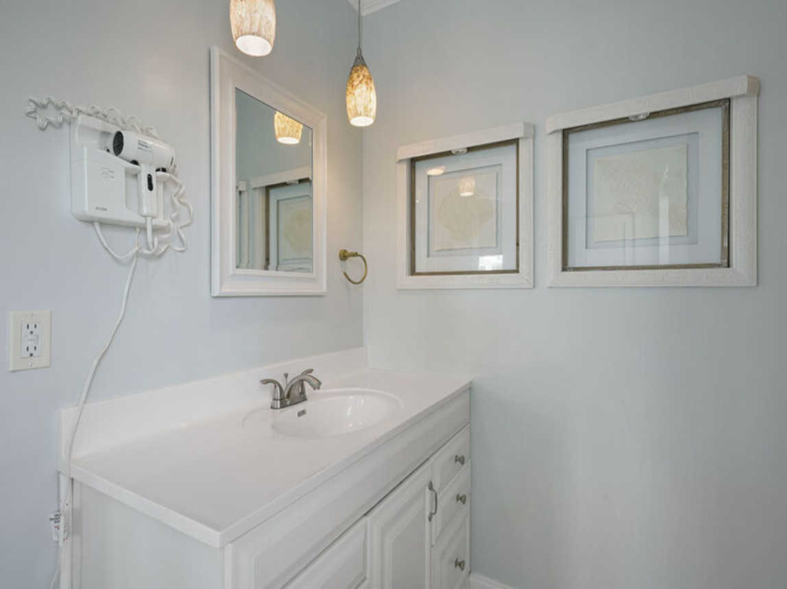 Flirty Flamingo - Pet-Friendly Vacation Rental House Near Beach with Game Room, Private Pool, & Carriage House in Crystal Beach, Florida  - Five Star Properties Destin/30A