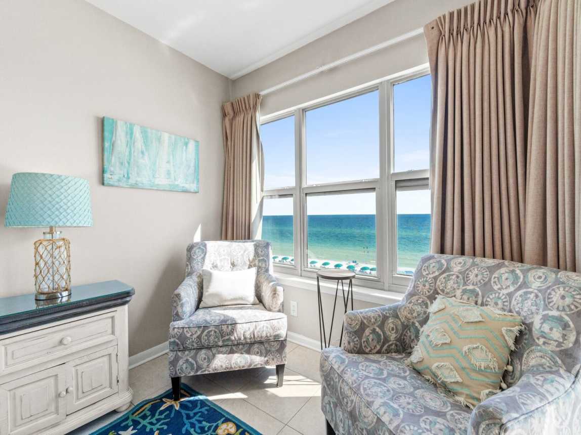 Master suite features a king-size bed, access to the balcony, and a private bathroom with a shower/tub combo.