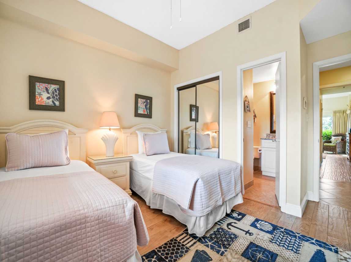 Guest bedroom showing full size closet for unpacking and storage and your private entry into the guest bath.