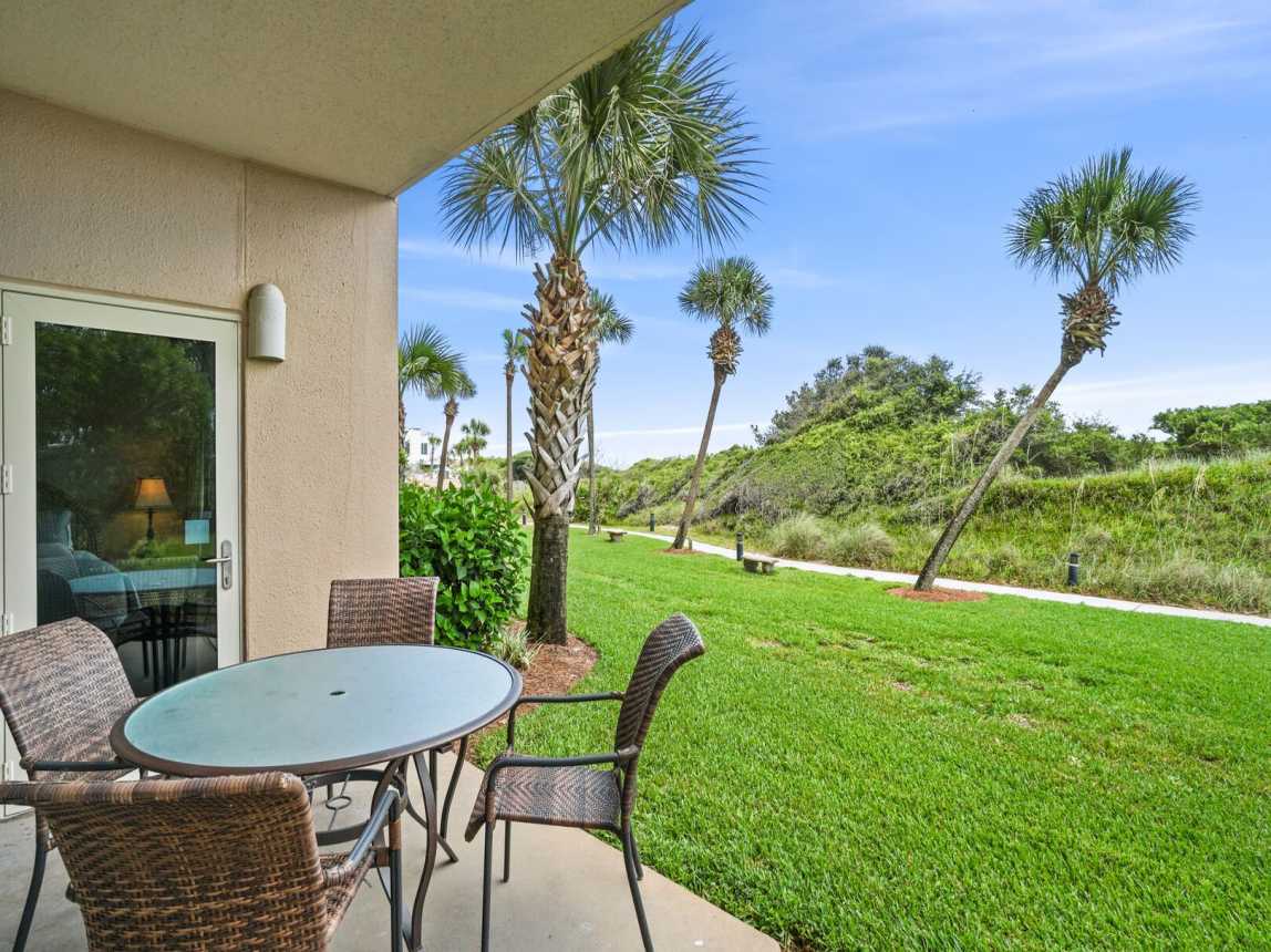 Patio showing path to either the pool or boardwalk to the beach access.