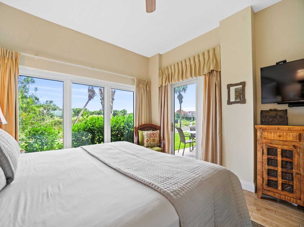 Master suite has private patio access, wall flat screen tv with WIFI and cable. Perfect view of the gardens.