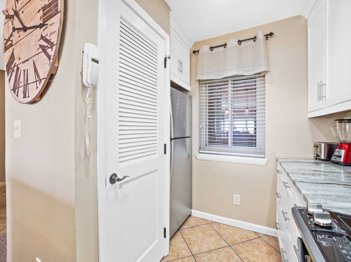 Large capacity refrigerator, and plenty of cabinet and counter space for easy and fast preparations of a good home cooked meal.  Washer/dryer behind the door.