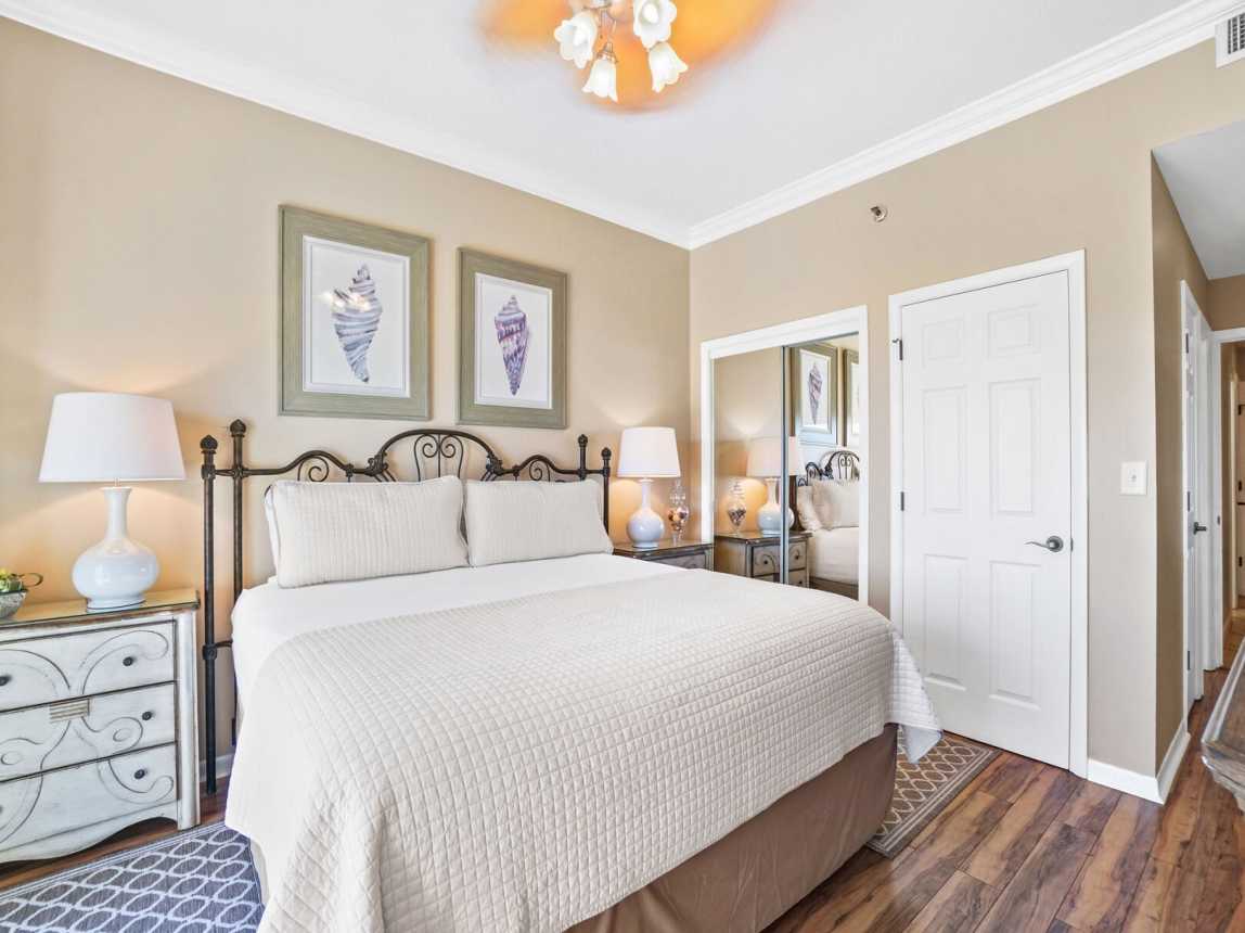 Two bedside tables with soft lit lamps,, double door mirrored closet for your wardrobe.