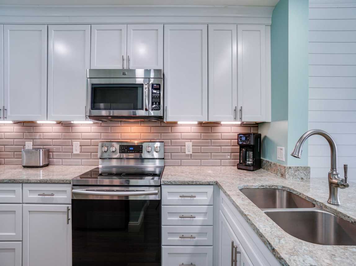 Spacious kitchen that will meet all our cooking needs. Fully stocked with dinnerware, utensils, pots, pans, bakeware.