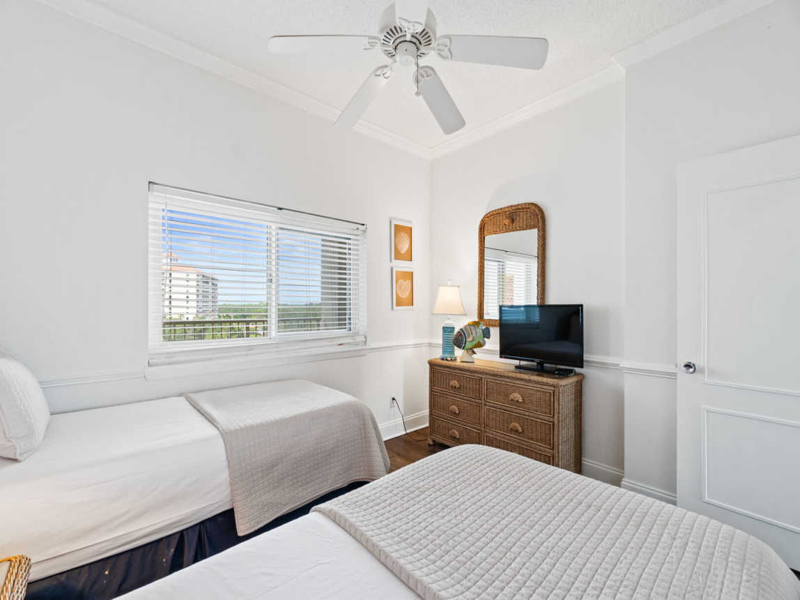 Guest room provides a small dresser and mirror with a room size TV. Wifi and cable provided.