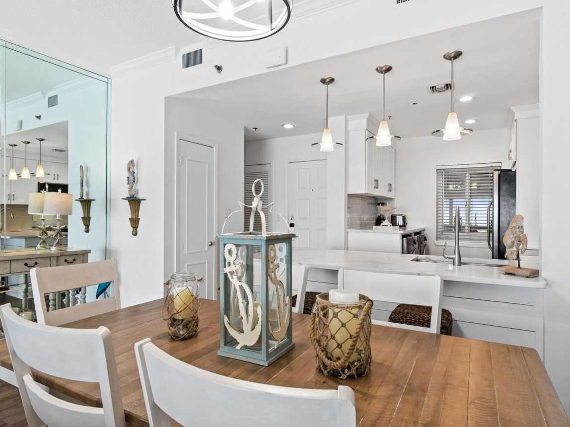 In the dining room you have a large table that seats 6. There are also two breakfast bars stools for extra seating.