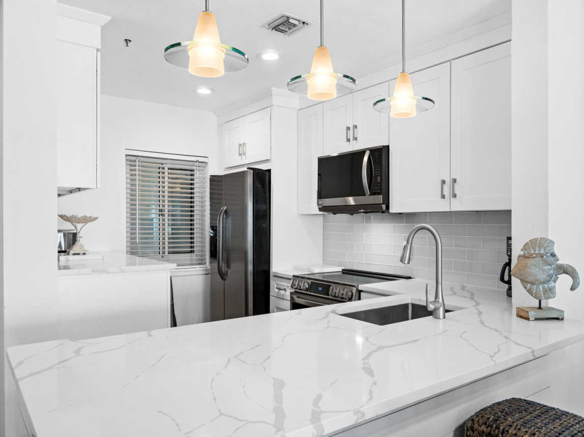 Bright and roomy kitchen to prepare your favorite meals. This updated kitchen provides you with all the necessities you need for any meal. There is a full size washer and dryer in the kitchen for your convenience.