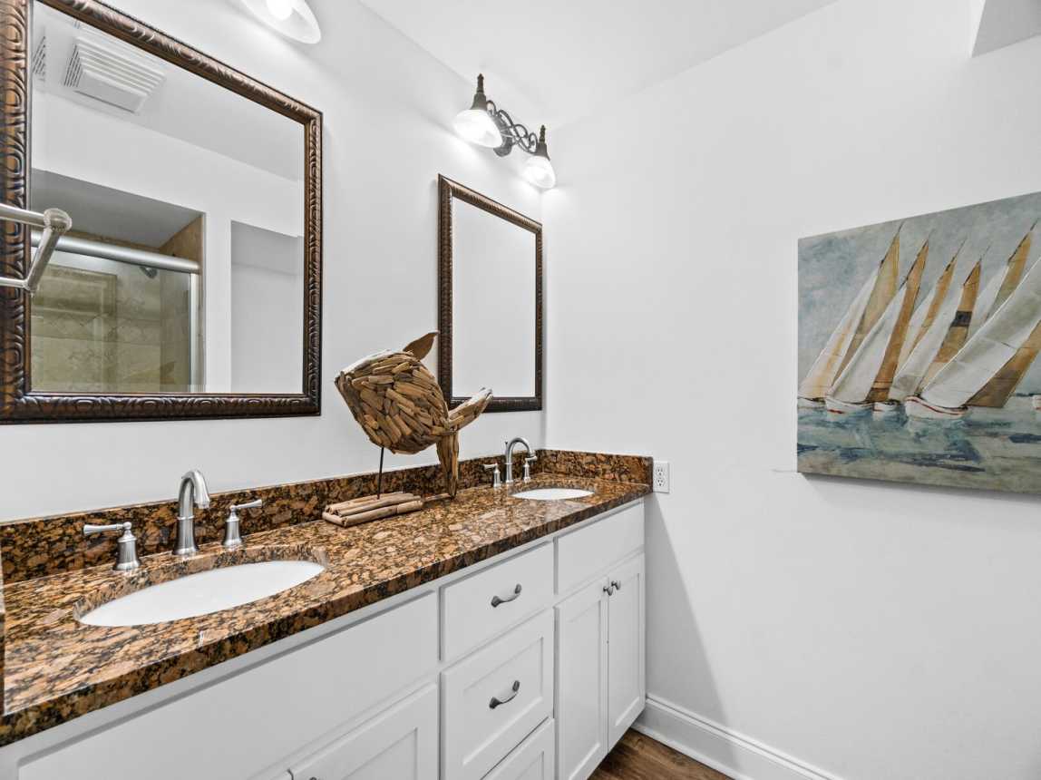 In the Master Bath you have a double vanity with 2 nice size mirrors and plenty of drawers and cabinets to keep all your bath & both supplies. It offers a tub/shower combo as well.