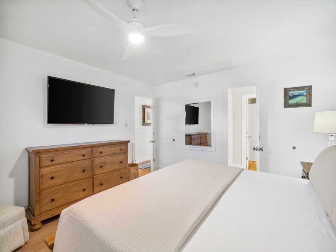 6 drawer dresser, large flat screen TV, and a ceiling fan provided for use and comfort.