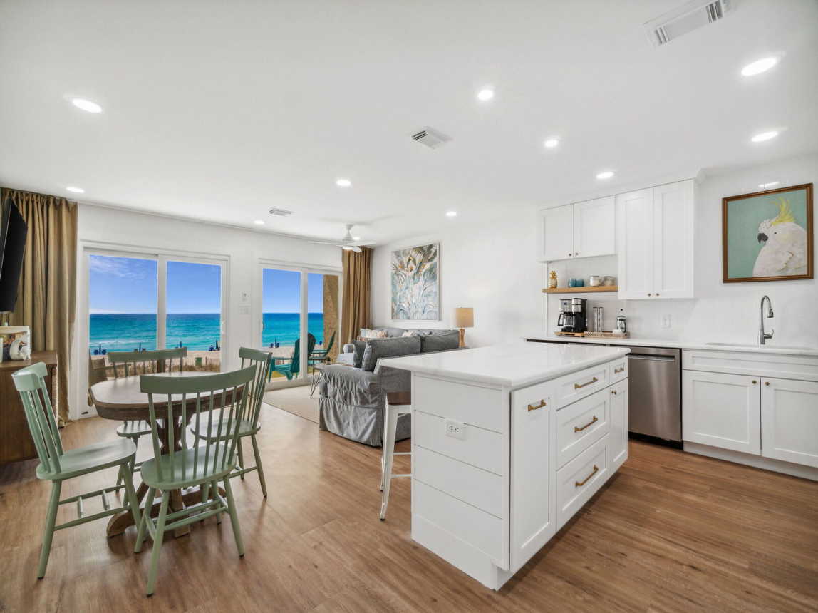 You have a full view of the entire living and dining area from the fully stocked kitchen. Not to mention the beautiful view to enjoy while preparing a favorite meal.