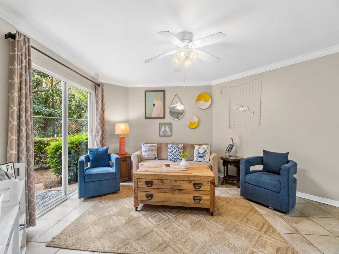 Get cozy and relax in the comfortably furnished living room with easy access to the outside garden patio.