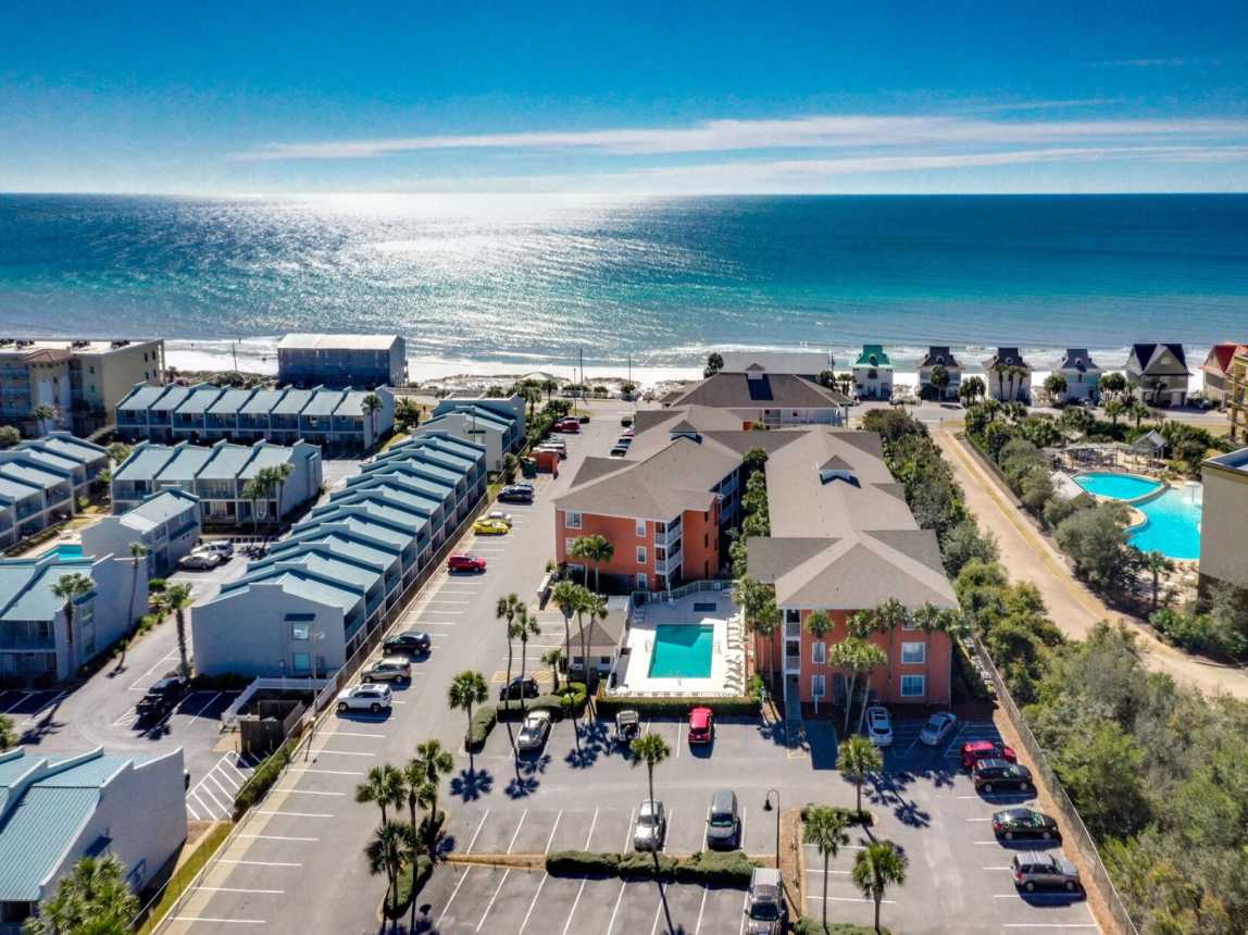 Ariel view showing 3 buildings and two pools for all guest to use. You are just a very short walk to the beach right across the road.