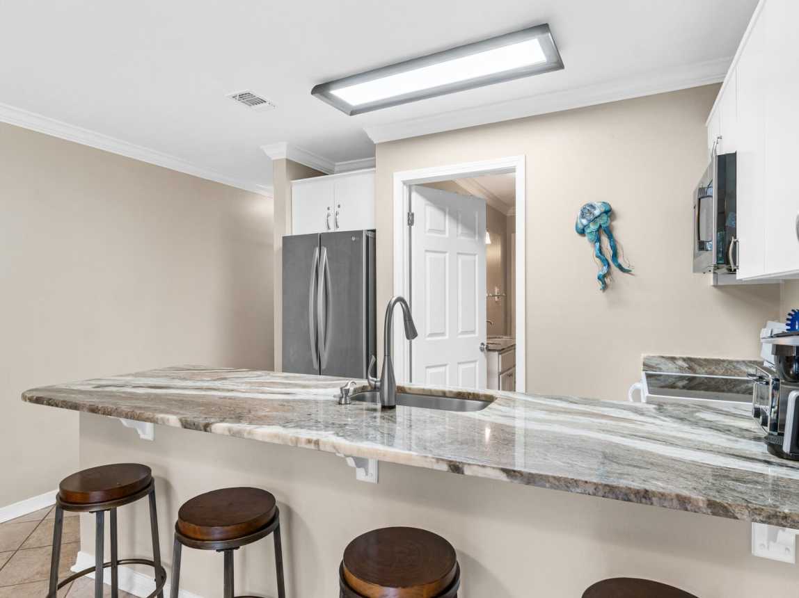 This kitchen may be small, put it provides everything you need to cook, bake, or just serve a beverage.  All needed wares available for use.