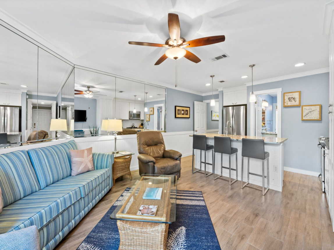 Showing the open area of the living room, breakfast bar and kitchen. Just cozy enough for a family of 4