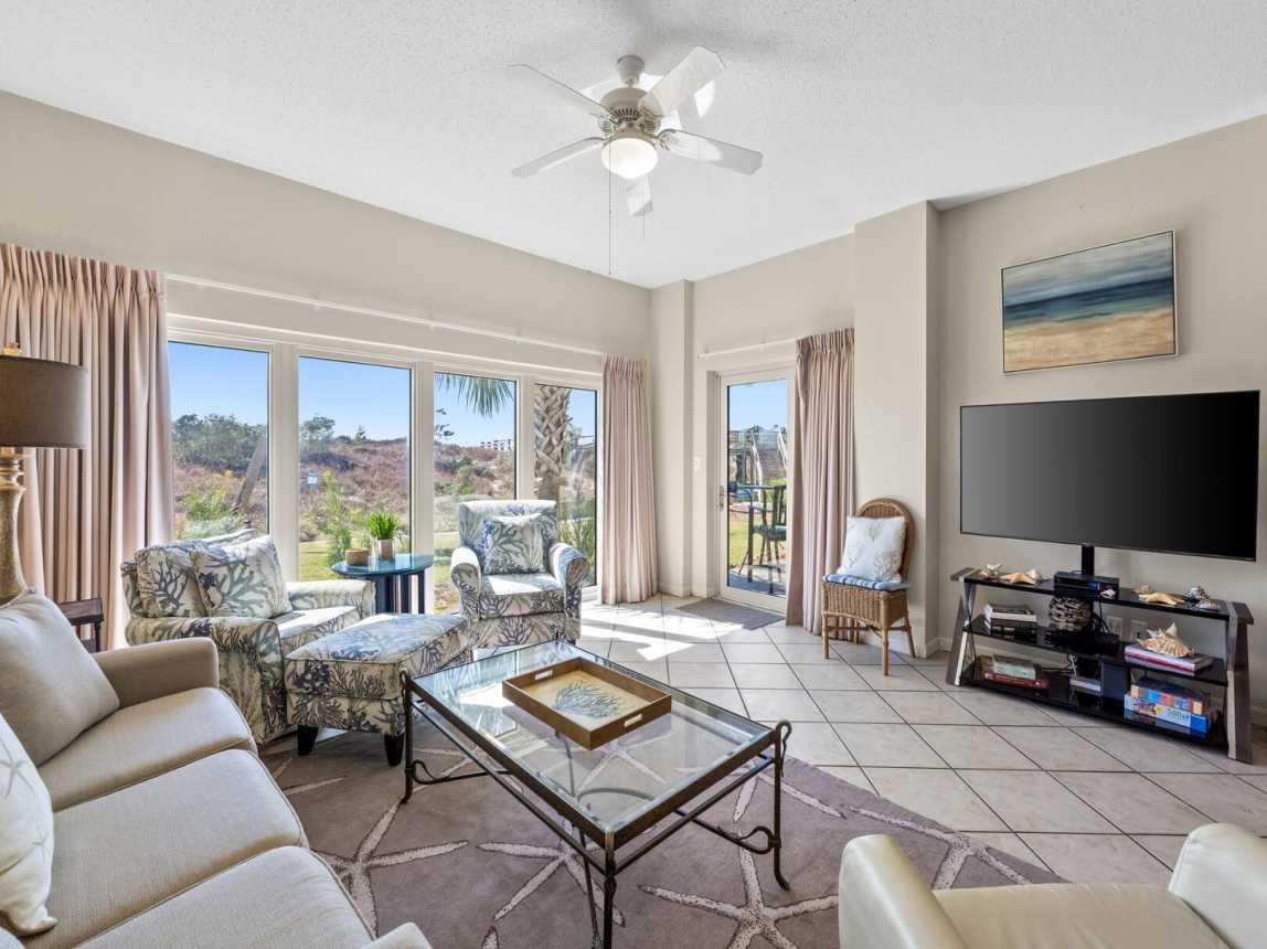Spacious living area with plenty of seating, big screen TV and beautiful views.