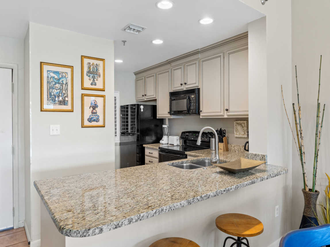 Enjoy this spacious and fully stocked kitchen that has everything from pots & pans, dinnerware, glassware, utensils, toaster, blender, coffee pot and bakeware. All you need is your food and beverage.