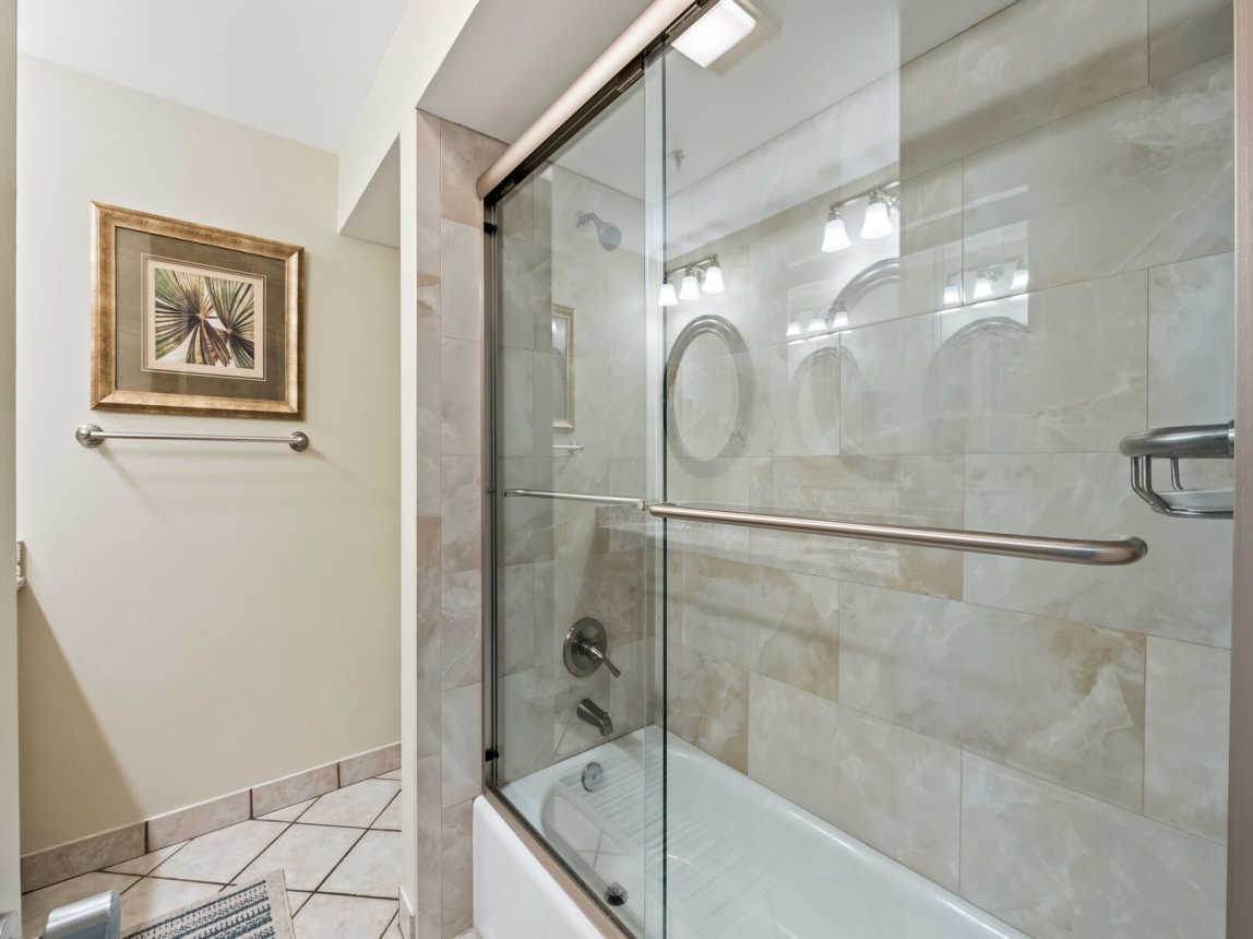 There is a shower/tub combo with glass enclosure and with a separate toilet area. Bath linens and bath accessories provided for your convenience.