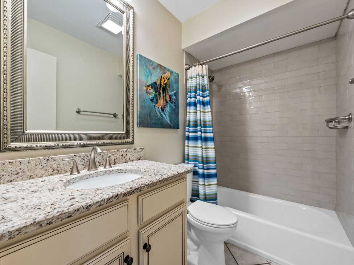Guest bath provides a nice size single vanity with mirror and plenty of  storage space. There is a tub/shower combo with all bath linens and bath accessories provided for your convenience.