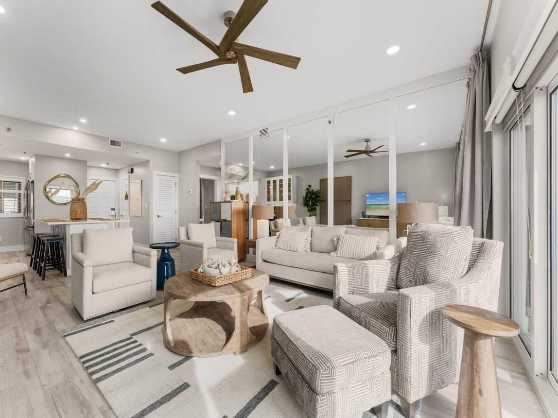 Living room with mirrored wall to give you an overall spacious feel while relaxing or taking a well deserved nap. Room enough to seat 6.