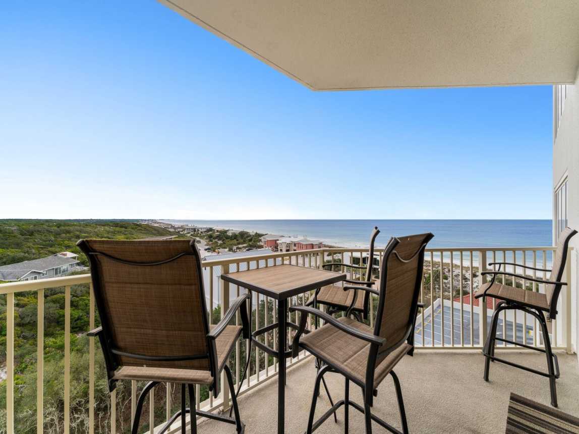 Corner balcony that looks over plush gardens and greenery looking east toward Panama City Beach. High top table and chairs to enjoy the cool breeze and crystal clear water.