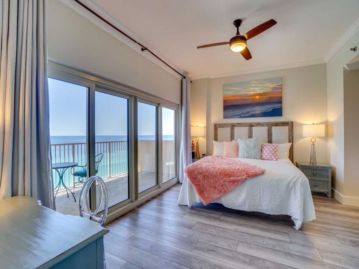 King bed with a gorgeous view of the beach for a morning sunrise. You will love the comfy bedding and lush pillows for a great night's rest.  Coffee in bed, anyone?