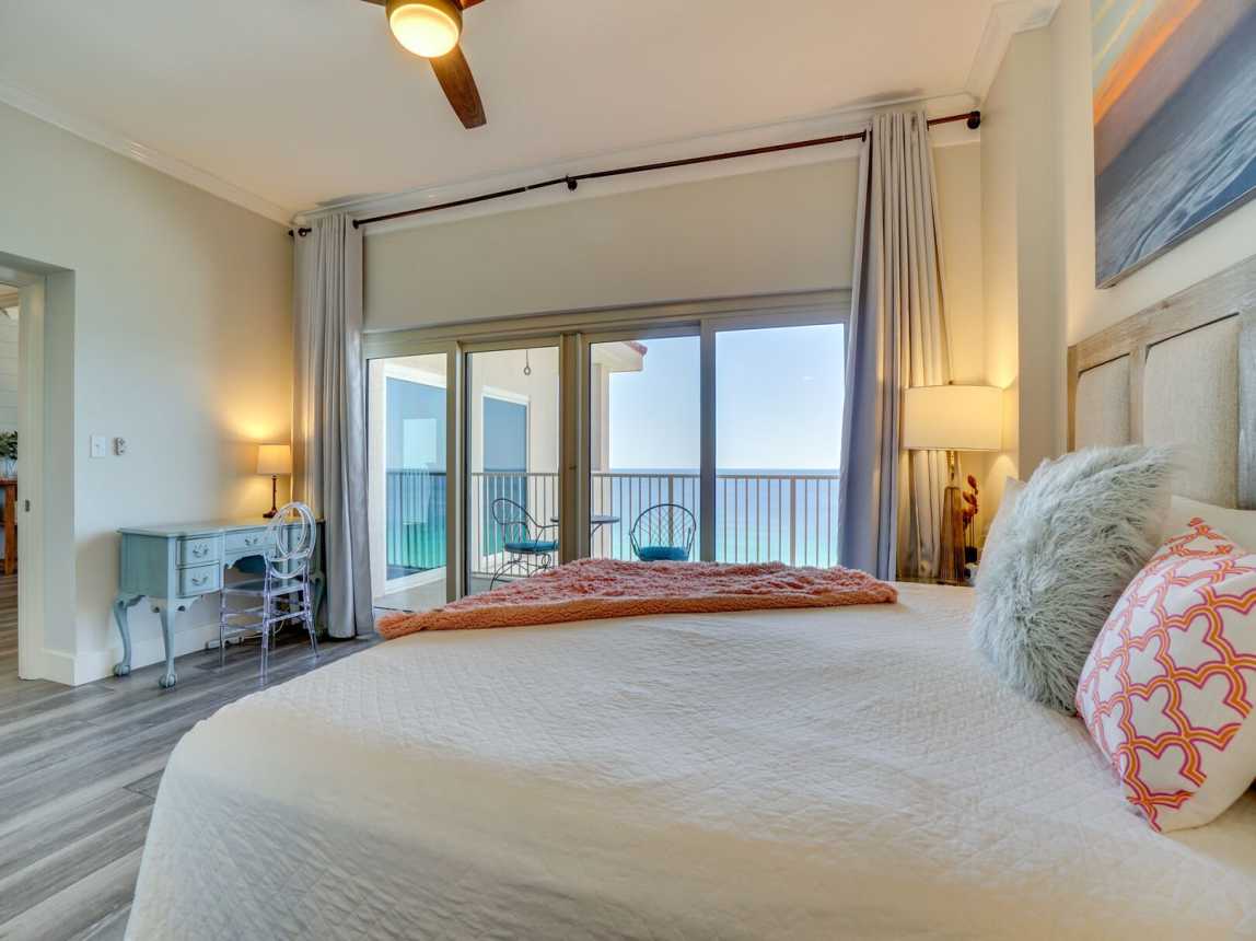 Bedroom and balcony with a gorgeous view of our emerald green waters.