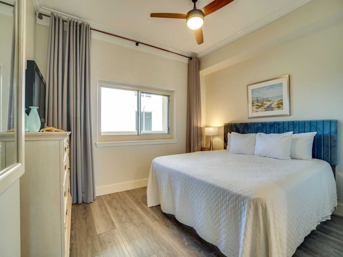 A cozy, comfortable king size bed dressed with crisp clean linen and just enough coverings for the warm summer nights.